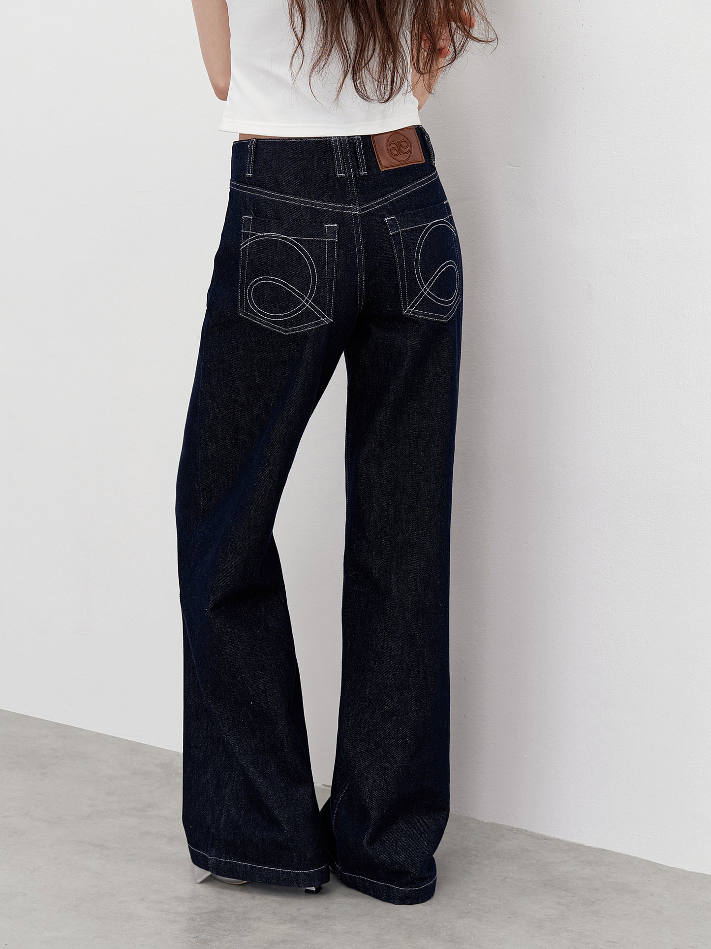 Flared Jeans With Logo Stitched Pockets