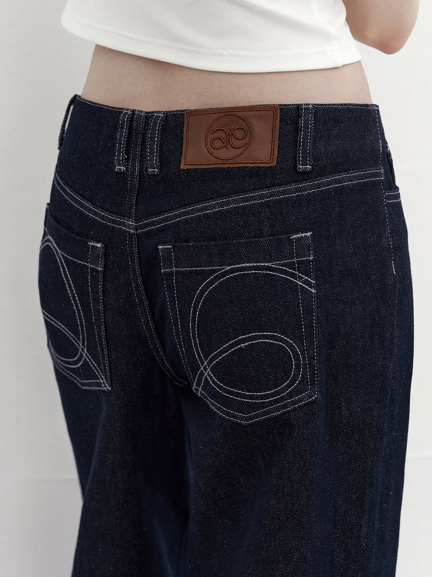 Flared Jeans With Logo Stitched Pockets