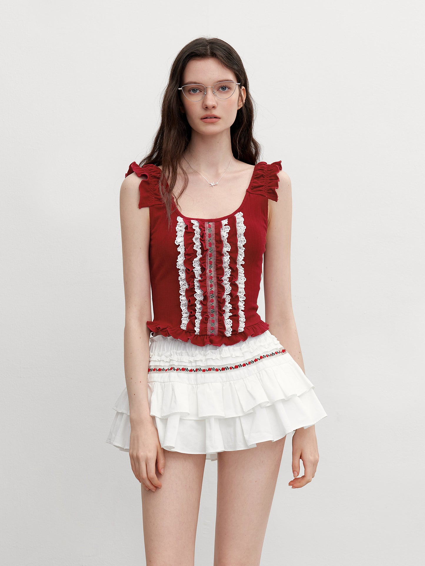 Sleeveless Cropped Ruffle Top With Floral Detail