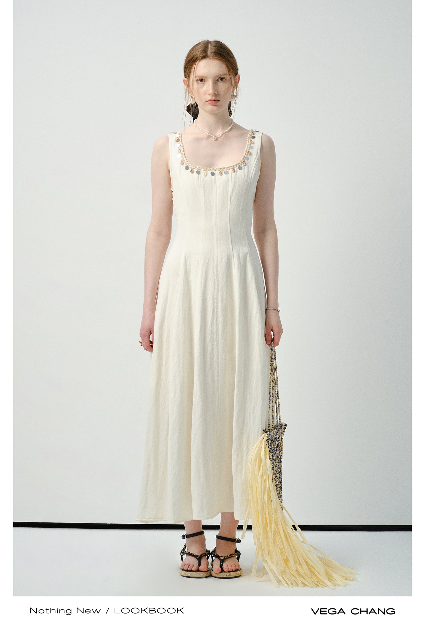Sleeveless Dress With Shell-Decorated Neckline