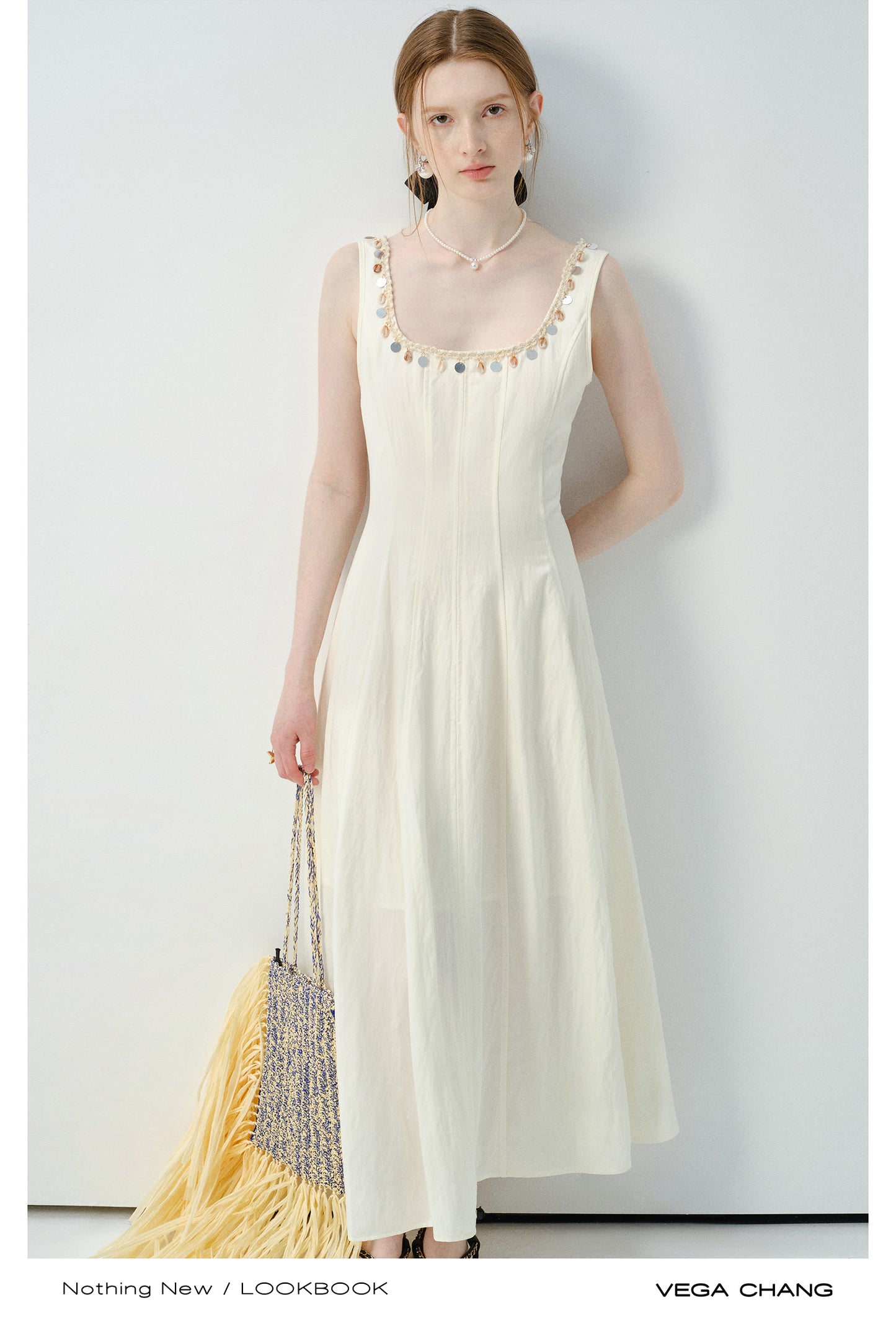 Sleeveless Dress With Shell-Decorated Neckline