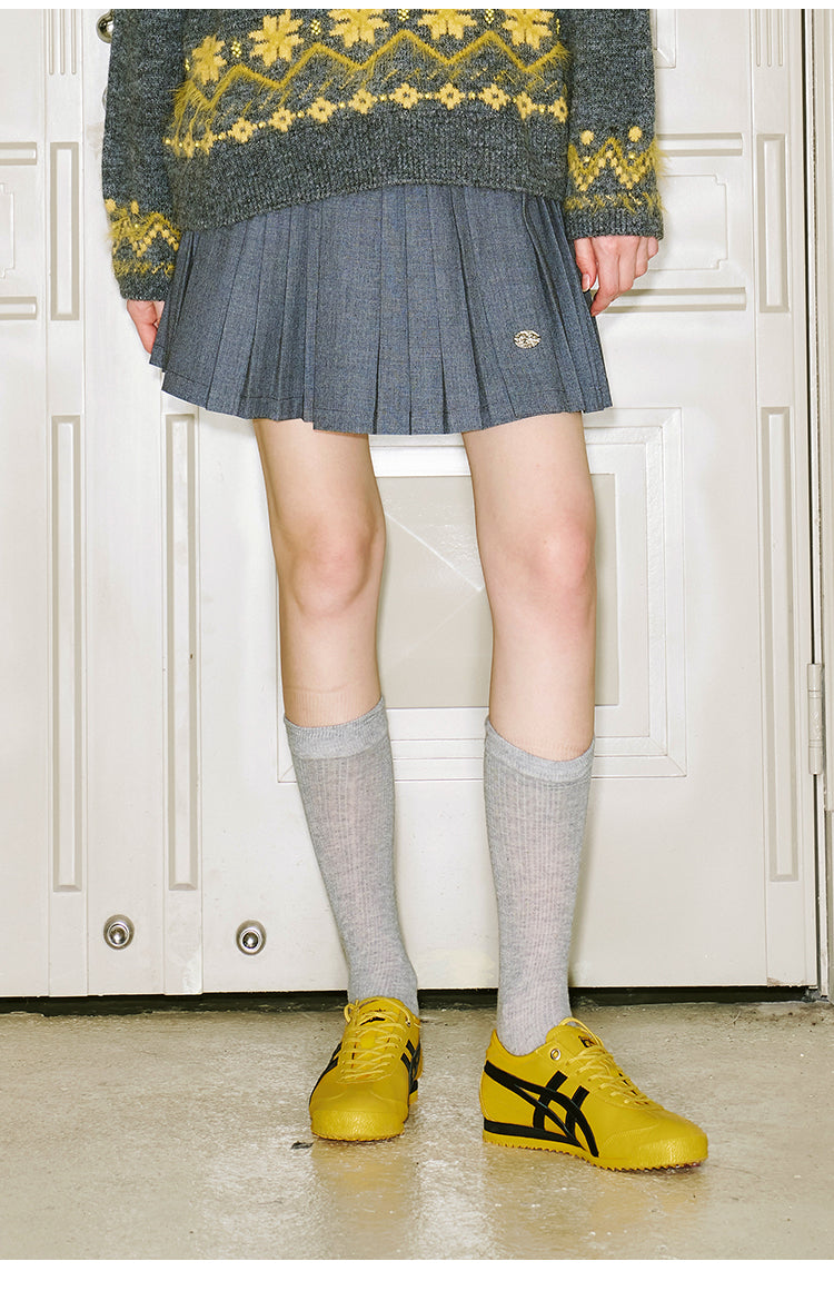 Short Pleated Skirt With Logo Charm