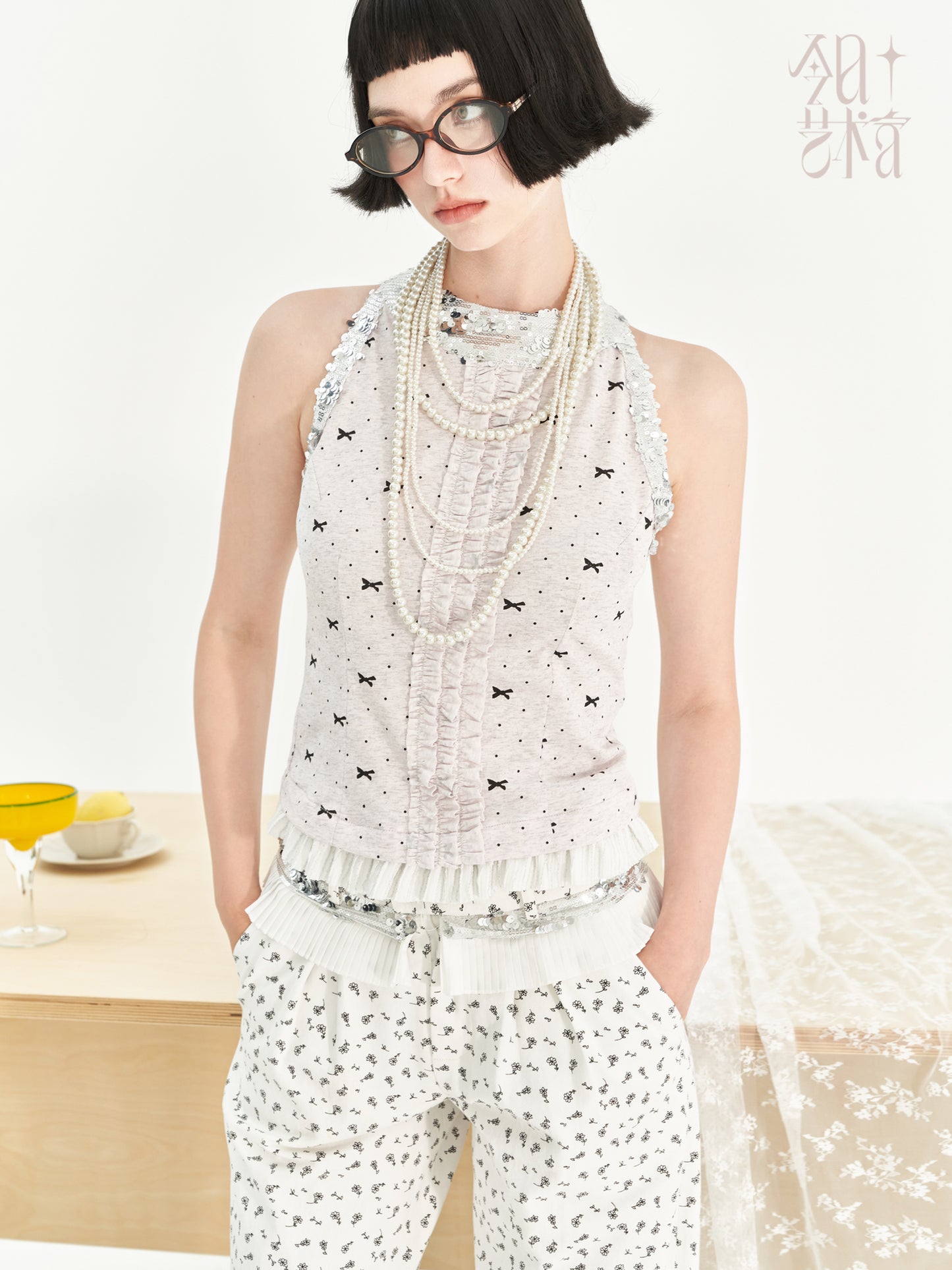 Polka Dot Ruffled Sleeveless Top With Sequin Neckline